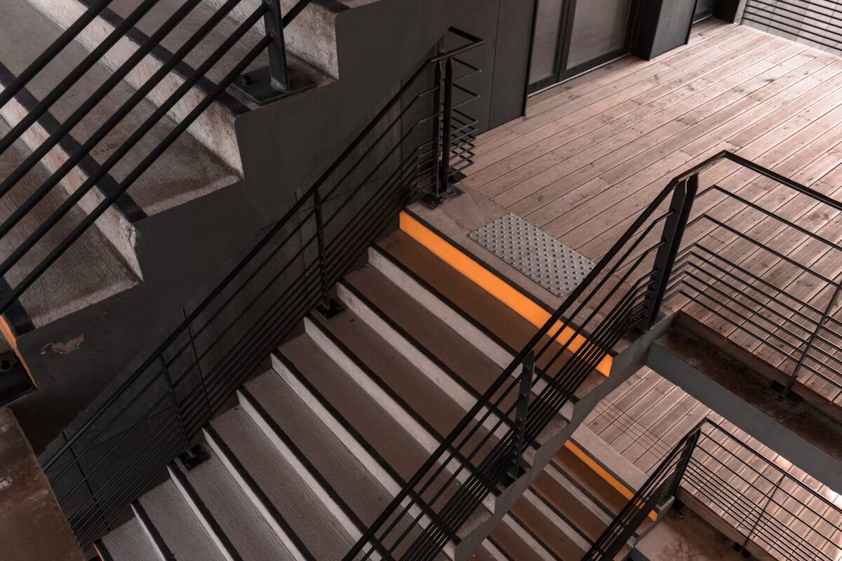 Gray steel staircase with metal railings