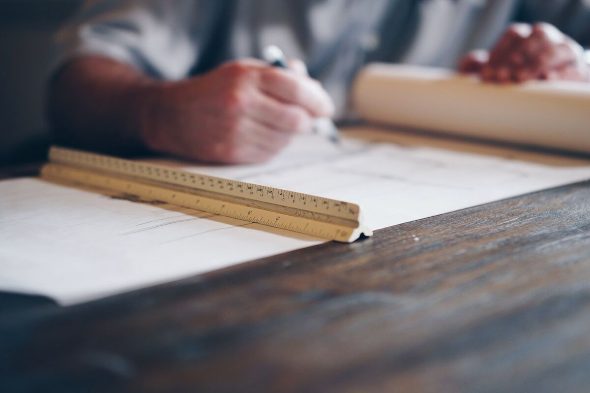 Drafter working on a technical blueprint